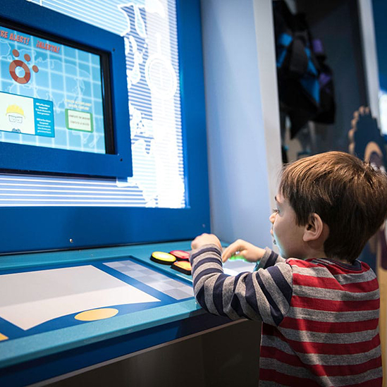 child playing with computer console component